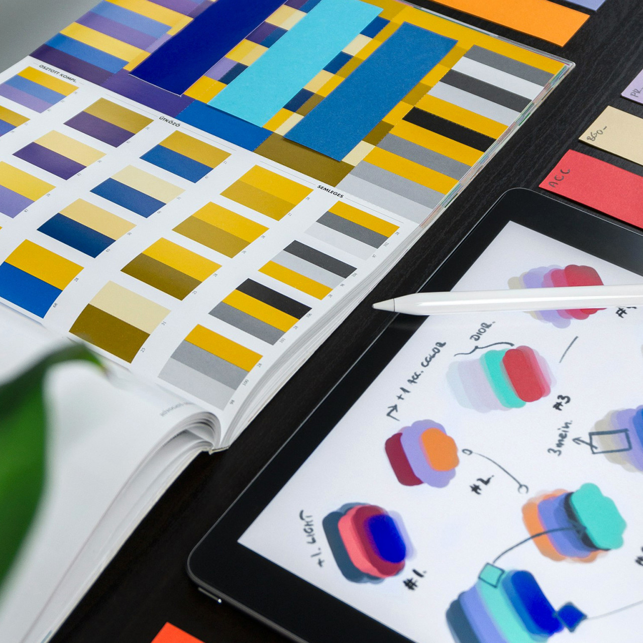 Photo of a style guide and a book on colour schemes.