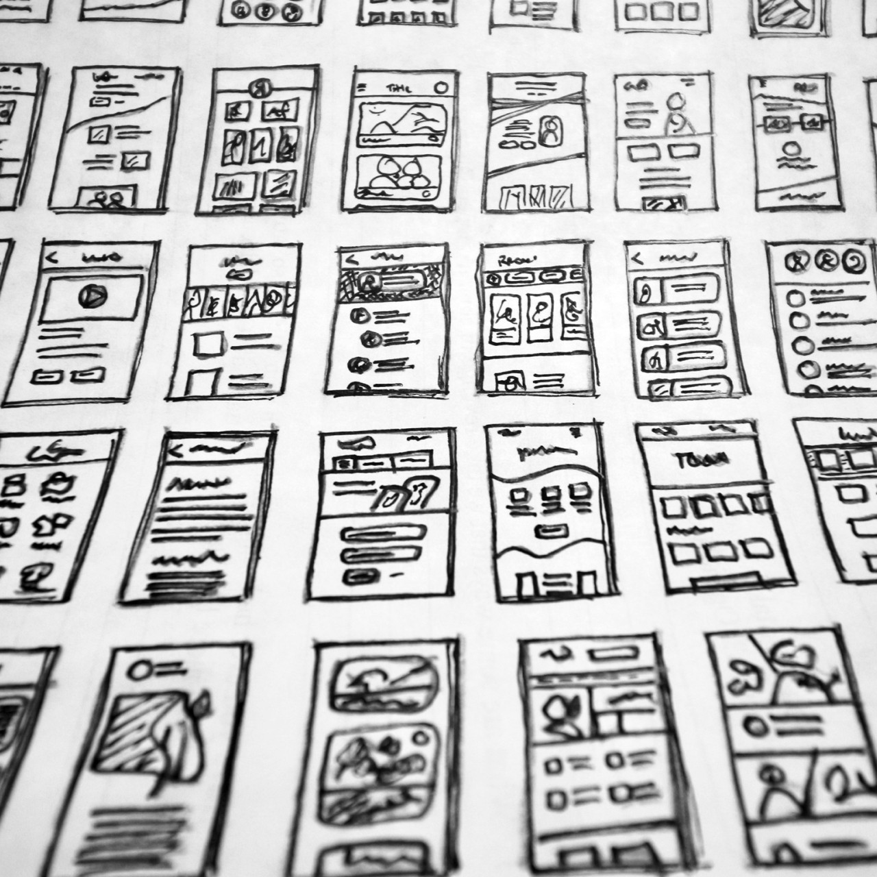 Photo of various sketches of web page templates.