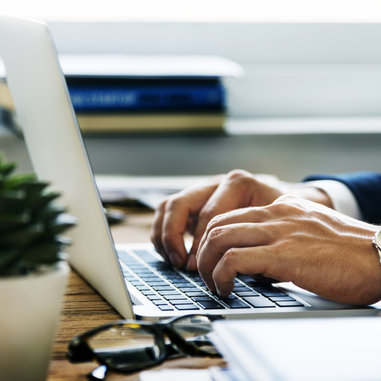 Photo of a businessman typing on his laptop.